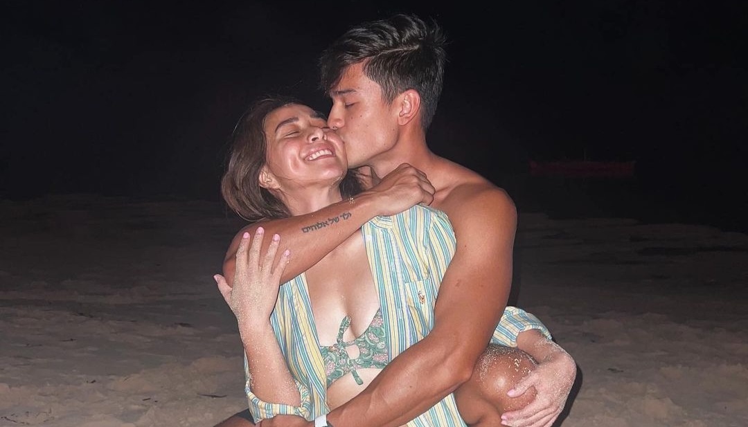 An intimate beach photo showing Cristine Reyes and Marco Gumabao. 