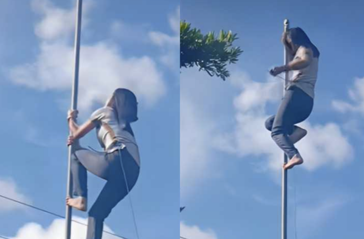 Teacher na inakyat ang flagpole para sa bandila ng Pilipinas, viral